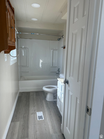446 Riverside Drive, Unit 24 Wellington, UT 84542 - Photo 14 of 14 Full bathroom featuring vanity, shower / bath combination, and light wood-style floors