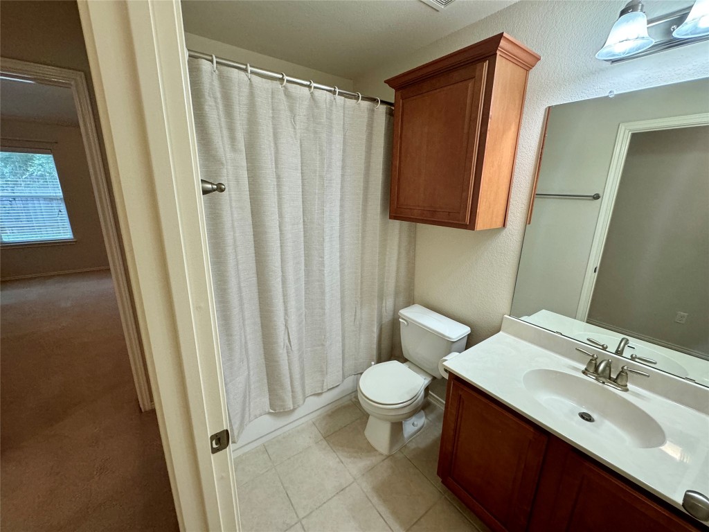 2209 Christoff Loop Austin, TX 78748 - Photo 13 of 25 a bathroom with a sink and a mirror