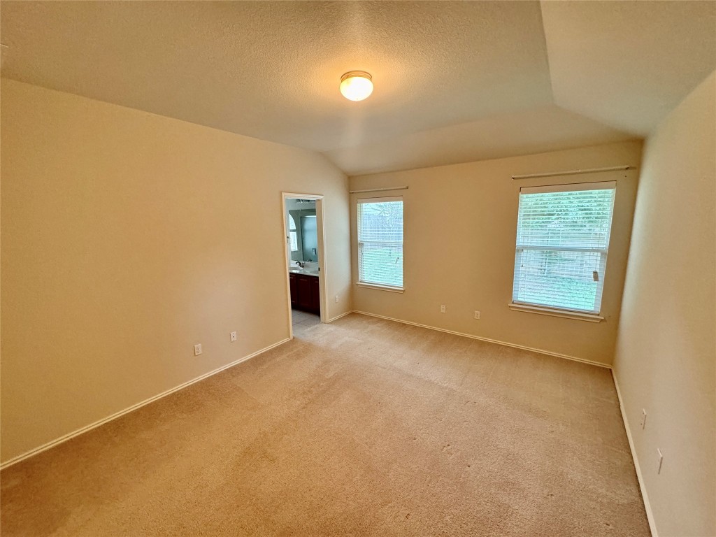 2209 Christoff Loop Austin, TX 78748 - Photo 16 of 25 an empty room with windows and entrance