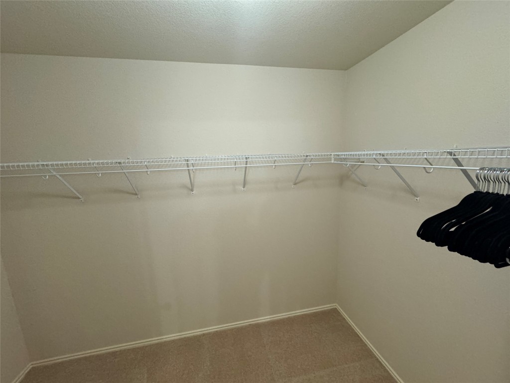 2209 Christoff Loop Austin, TX 78748 - Photo 20 of 25 a view of a room with racks on the wall