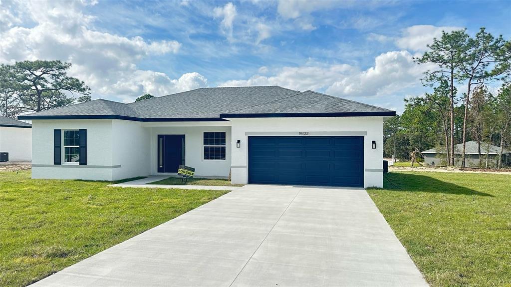 15122 Southwest 61st Court Road Ocala, FL 34473 - Photo 1 of 1 a front view of house with yard and green space