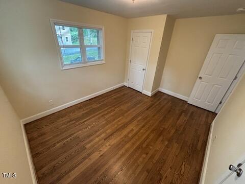 101 Newell Street Durham, NC 27705 - Photo 15 of 29 a view of an empty room with wooden floor and a window