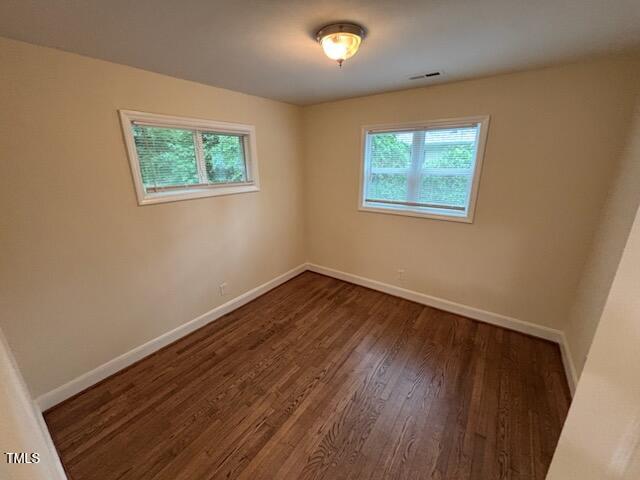 101 Newell Street Durham, NC 27705 - Photo 17 of 29 a view of an empty room with wooden floor and a window