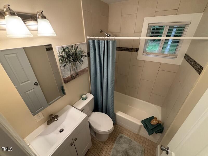 101 Newell Street Durham, NC 27705 - Photo 19 of 29 a bathroom with a toilet sink and mirror