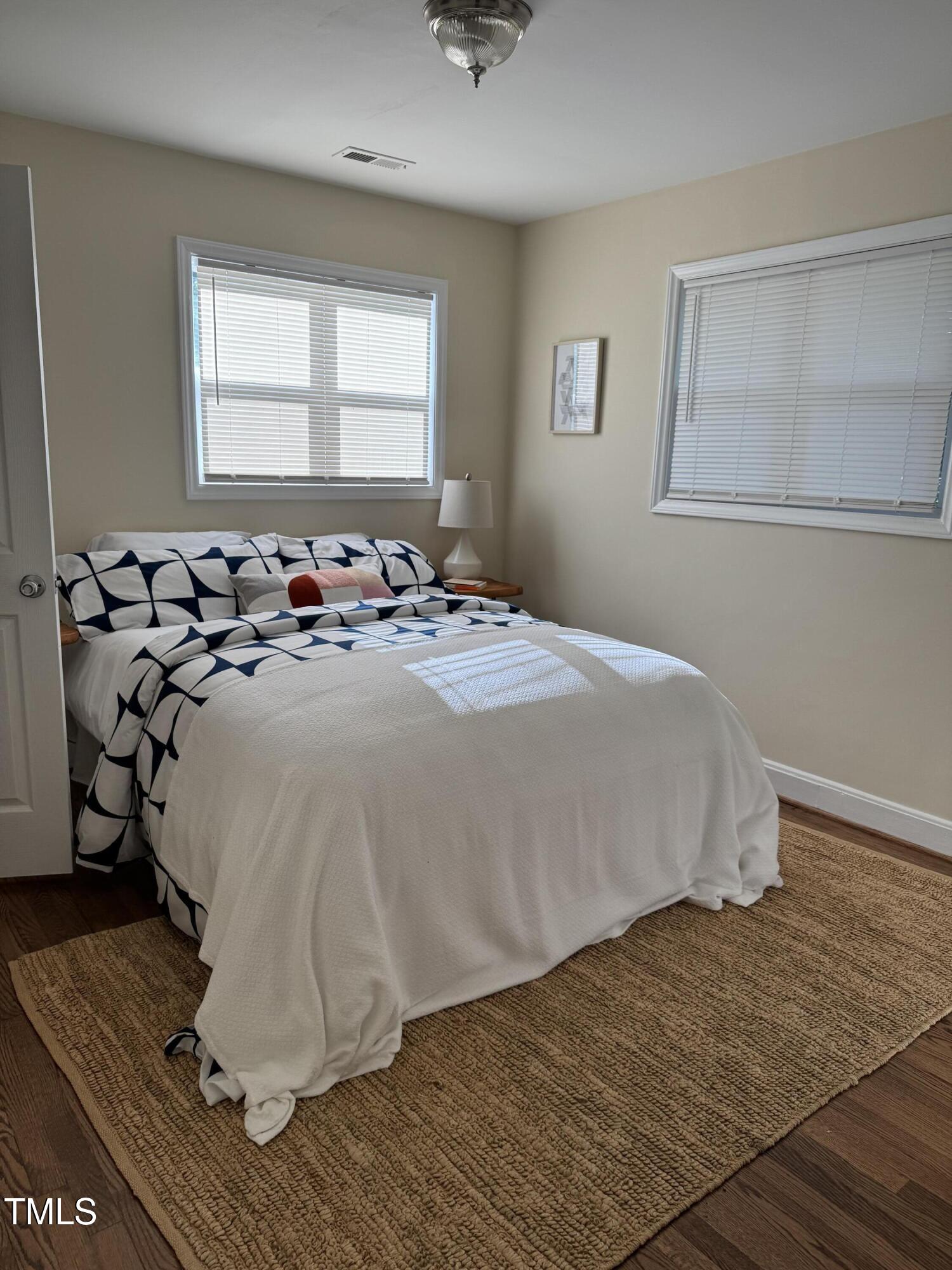 101 Newell Street Durham, NC 27705 - Photo 20 of 29 a bedroom with a bed and window