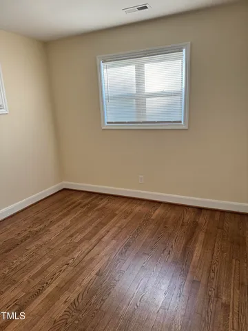 a bedroom with a bed and cabinets