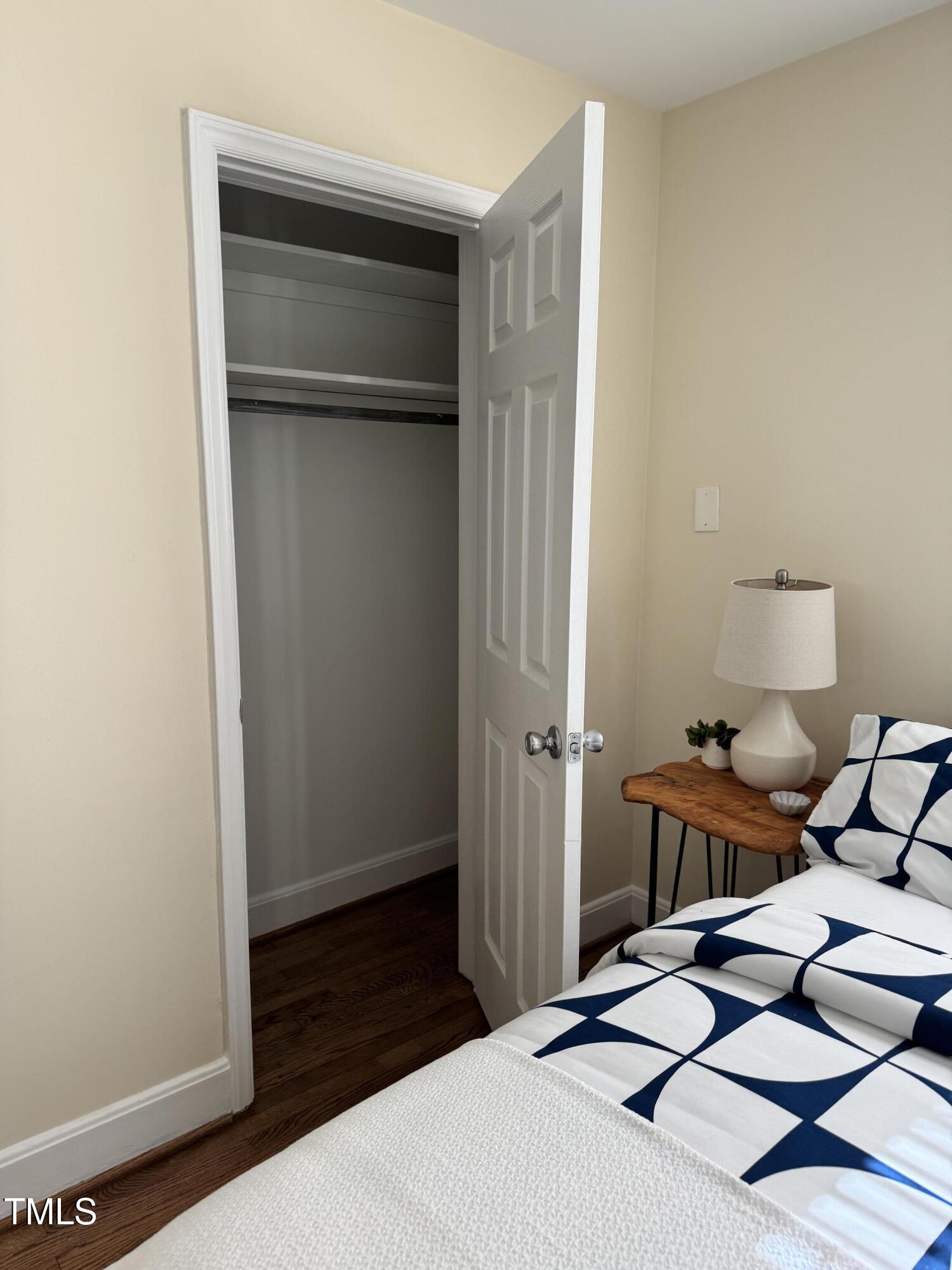 101 Newell Street Durham, NC 27705 - Photo 22 of 29 a bedroom with a bed and cabinets