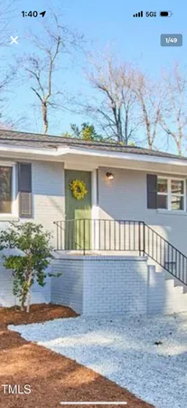 a view of a house with potted plants