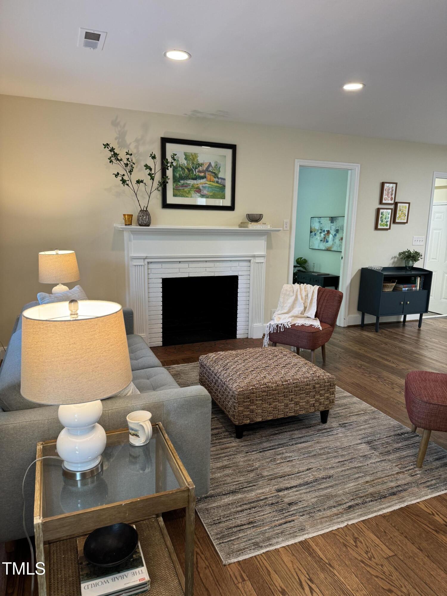 101 Newell Street Durham, NC 27705 - Photo 28 of 29 a living room with furniture and a fireplace
