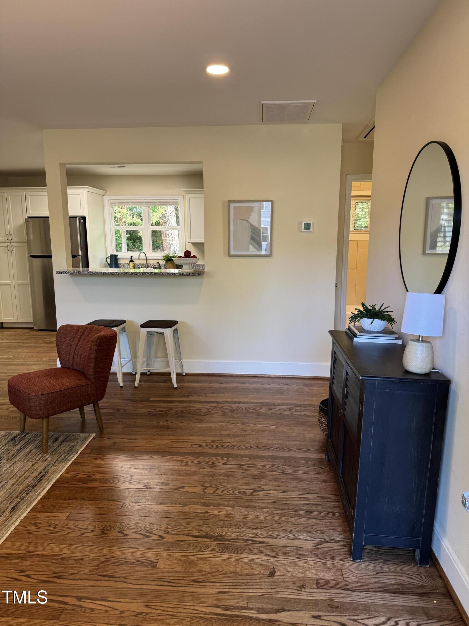 101 Newell Street Durham, NC 27705 - Photo 29 of 29 a living room with table chairs and a wooden floor