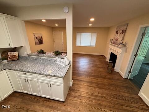 101 Newell Street Durham, NC 27705 - Photo 6 of 29 a kitchen with sink cabinets and wooden floor