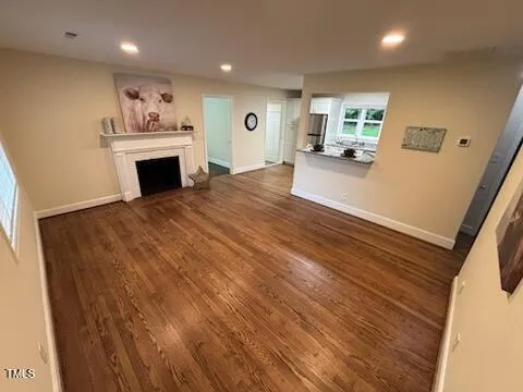 a view of a kitchen with furniture and a fireplace