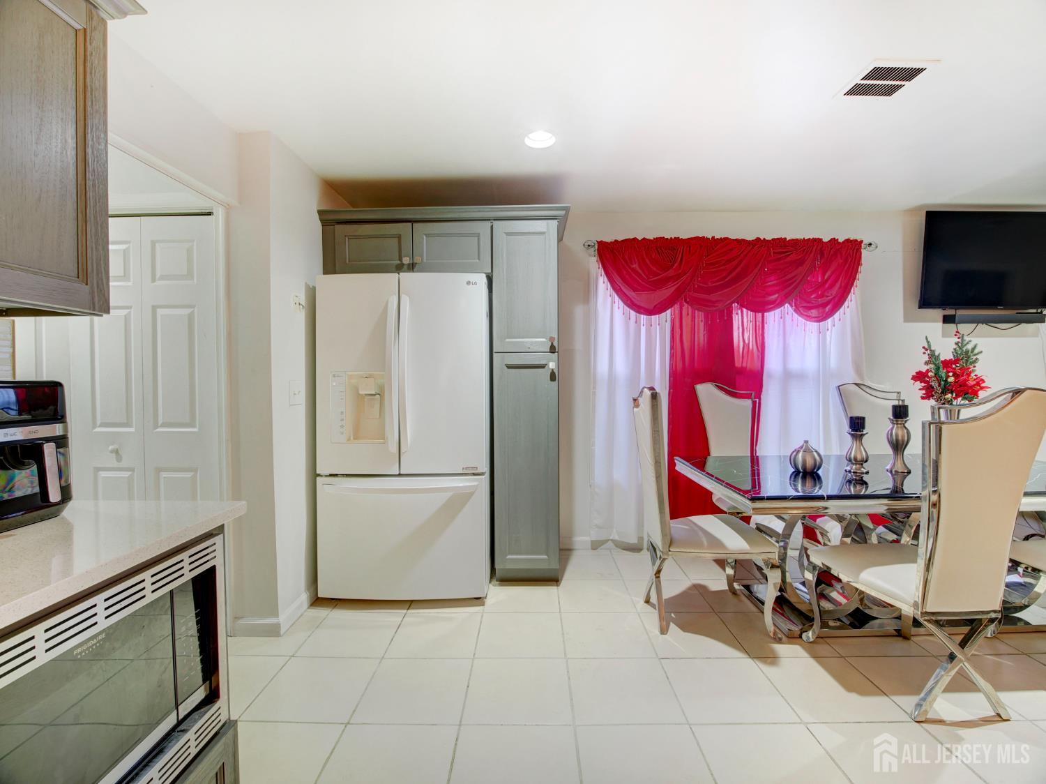 267 Watson Avenue Perth Amboy, NJ 08861 - Photo 17 of 24 a kitchen with granite countertop a refrigerator and a sink