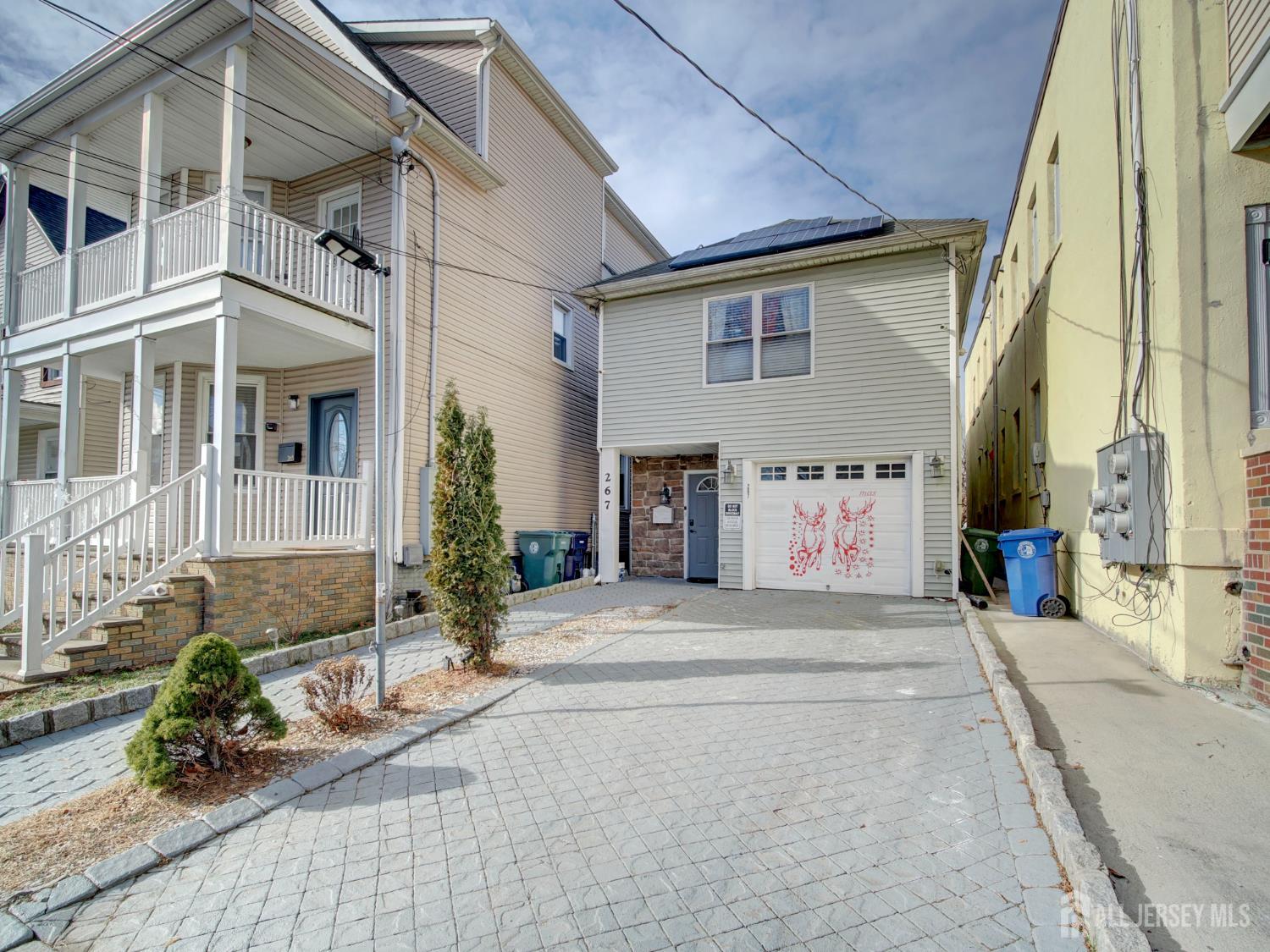 267 Watson Avenue Perth Amboy, NJ 08861 - Photo 24 of 24 a front view of a house with garden