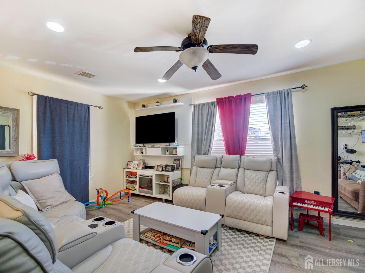 267 Watson Avenue Perth Amboy, NJ 08861 - Photo 5 of 24 a living room with furniture and a flat screen tv