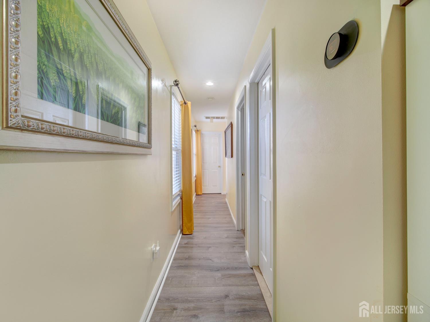 267 Watson Avenue Perth Amboy, NJ 08861 - Photo 6 of 24 a view of a hallway with wooden floor