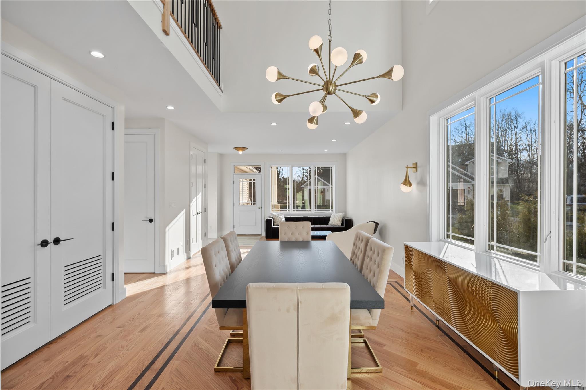 57 Dessau Circle Spring Valley, NY 10977 - Photo 16 of 48 Dining space with recessed lighting, a chandelier, light wood finished floors, radiator heating unit, and a high ceiling