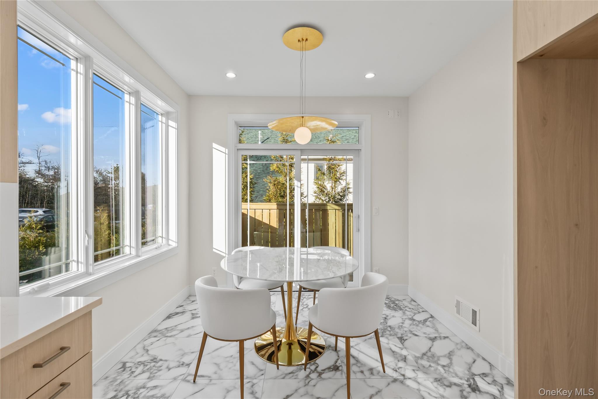 57 Dessau Circle Spring Valley, NY 10977 - Photo 21 of 48 Dining area featuring light marble finish flooring, recessed lighting, and plenty of natural light