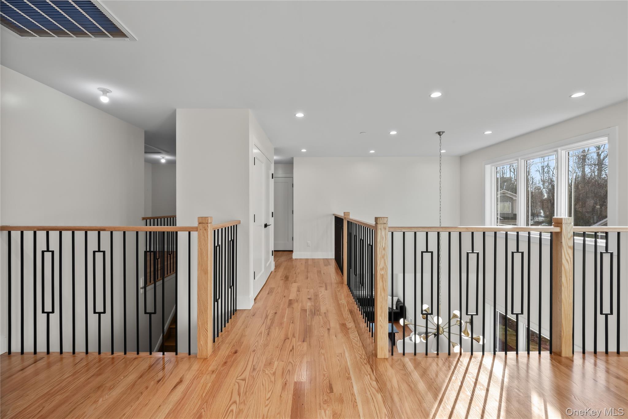 57 Dessau Circle Spring Valley, NY 10977 - Photo 35 of 48 Corridor featuring light wood finished floors, an upstairs landing, and recessed lighting