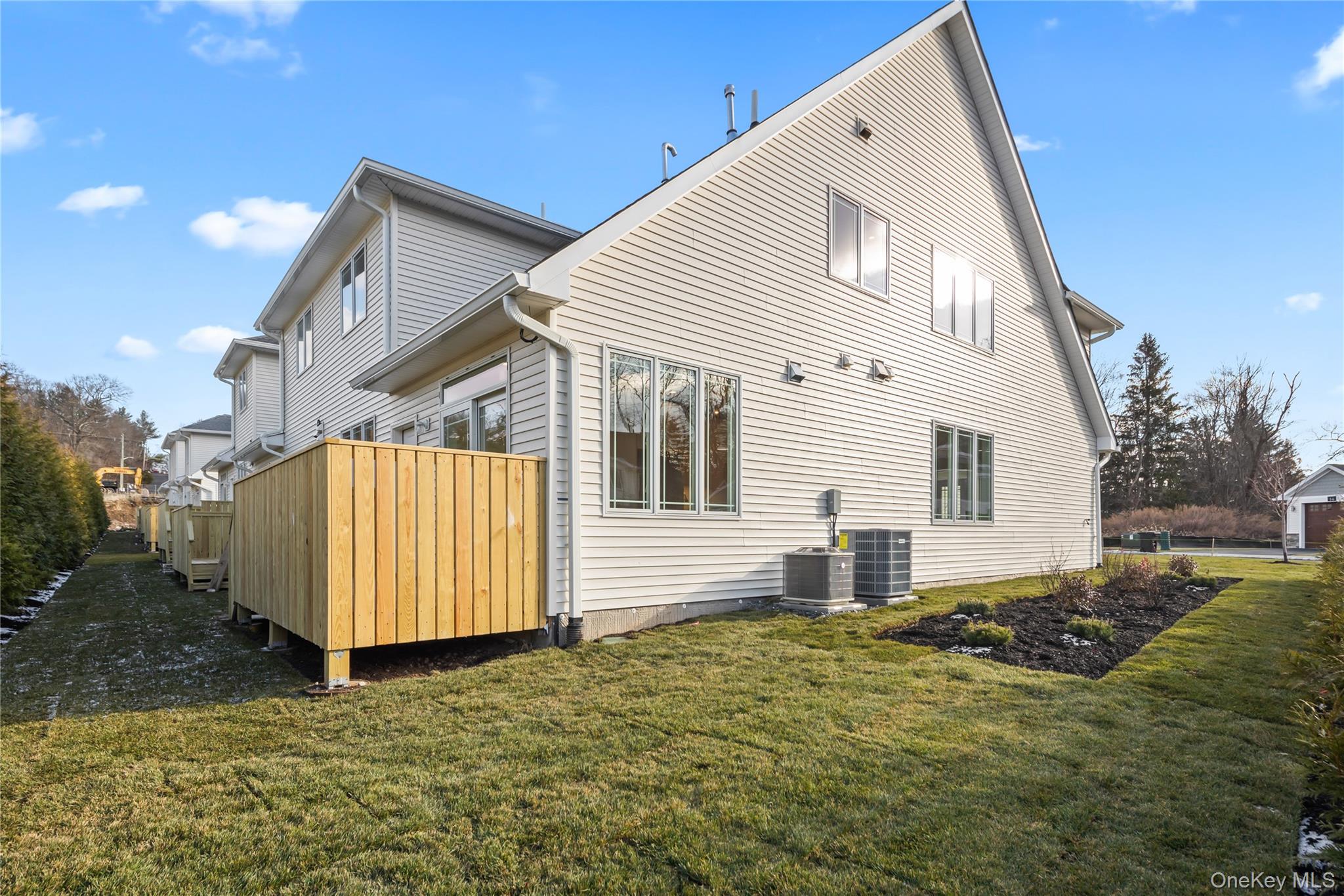 57 Dessau Circle Spring Valley, NY 10977 - Photo 45 of 48 Back of house featuring a yard and a deck