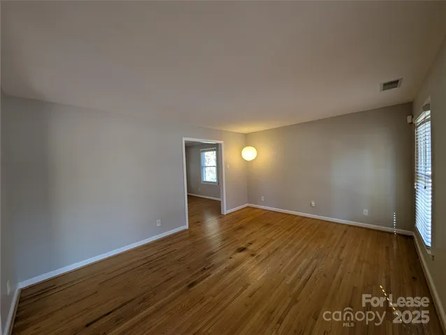 a view of an empty room and window