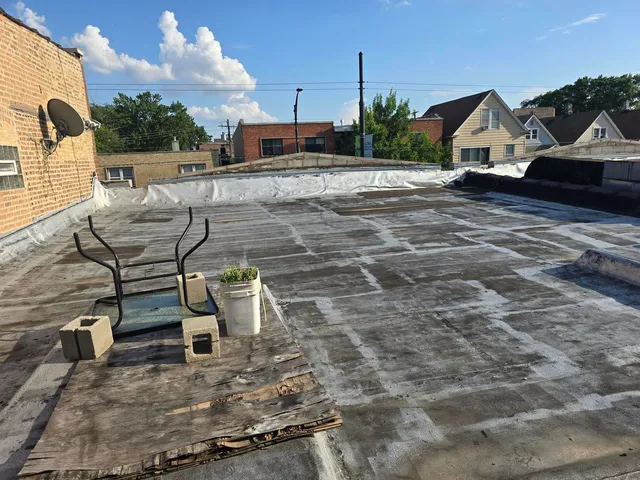 a view of a chairs and table in the patio