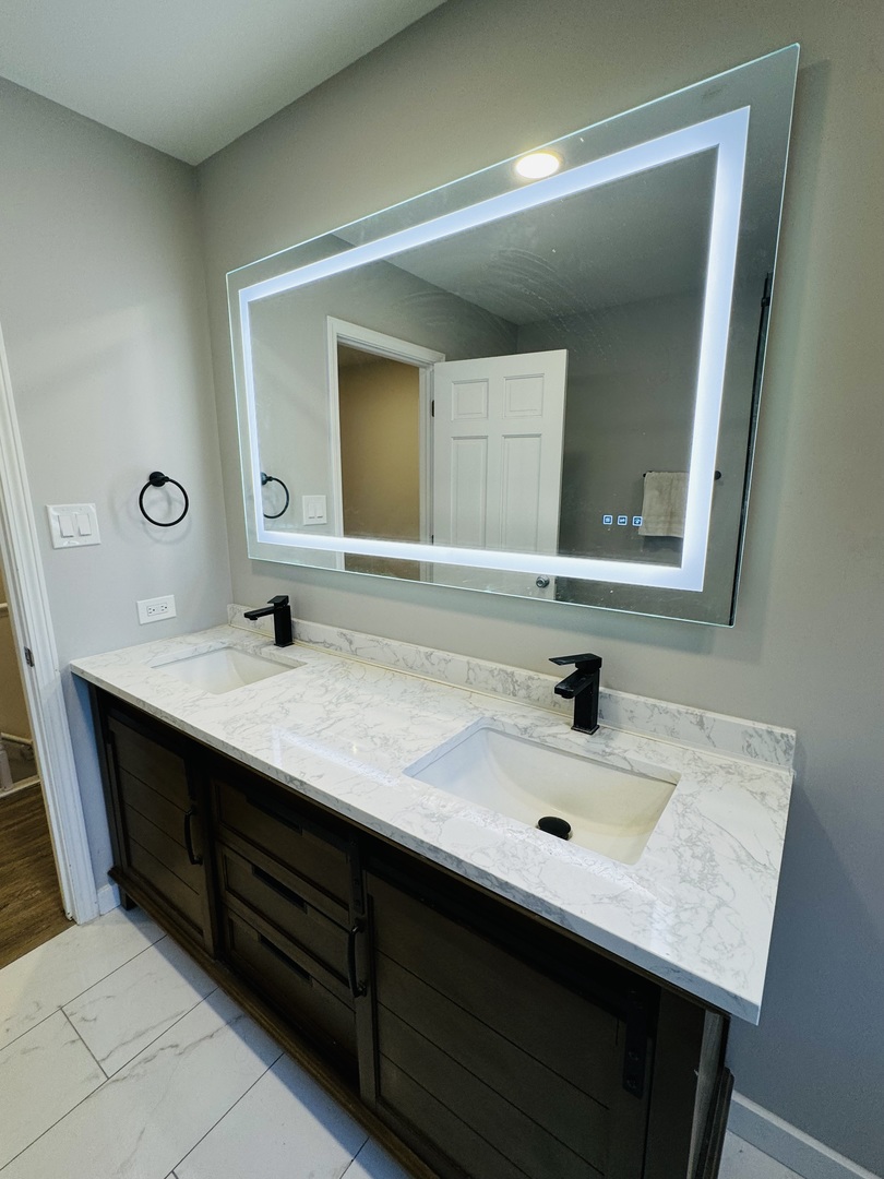 1398 East Gartner Road Naperville, IL 60540 - Photo 13 of 31 a bathroom with a sink and a mirror