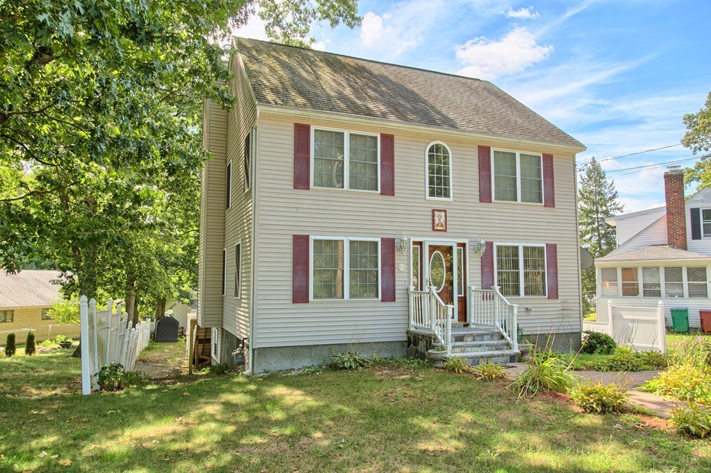 86 Acropolis Road Lowell, MA 01854 - Photo 2 of 30 a view of a house with a yard