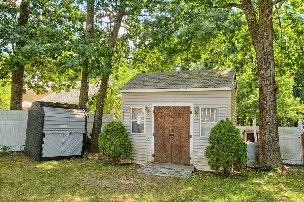 86 Acropolis Road Lowell, MA 01854 - Photo 26 of 30 a front view of a house with garden