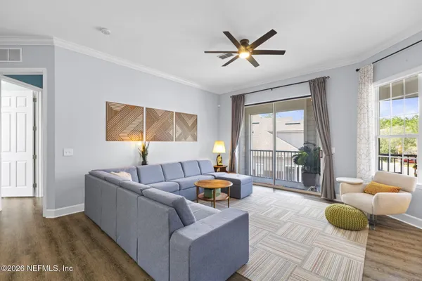 a bedroom with two bed and a flat screen tv