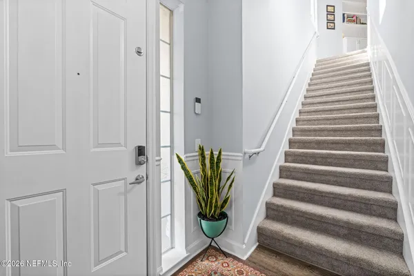 a kitchen with stainless steel appliances granite countertop a stove a sink dishwasher a refrigerator a microwave oven with granite countertops and cabinets