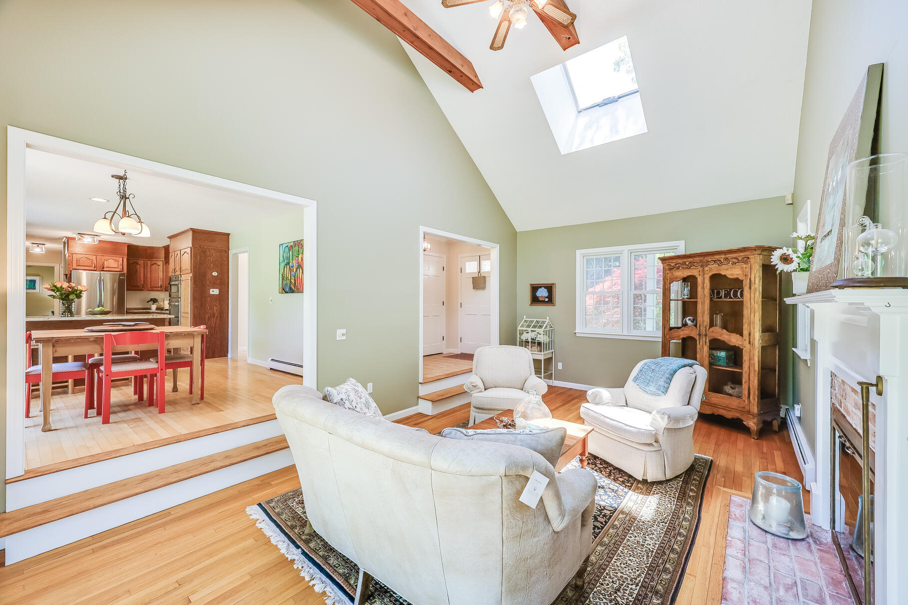 28 Sand Bar Lane Brewster, MA 02631 - Photo 11 of 74 a living room with fireplace furniture and a flat screen tv