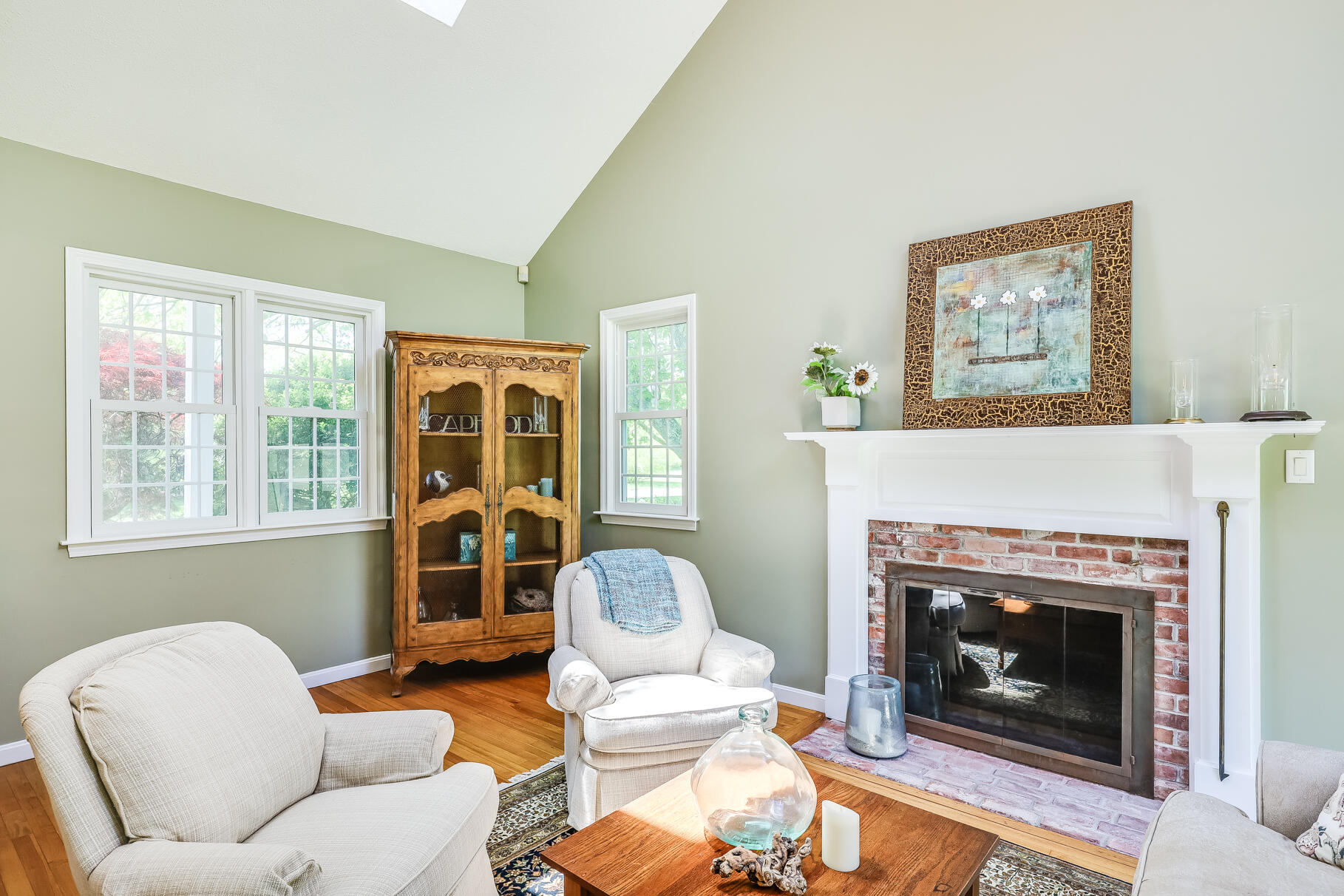 28 Sand Bar Lane Brewster, MA 02631 - Photo 12 of 74 a living room with furniture and a fireplace