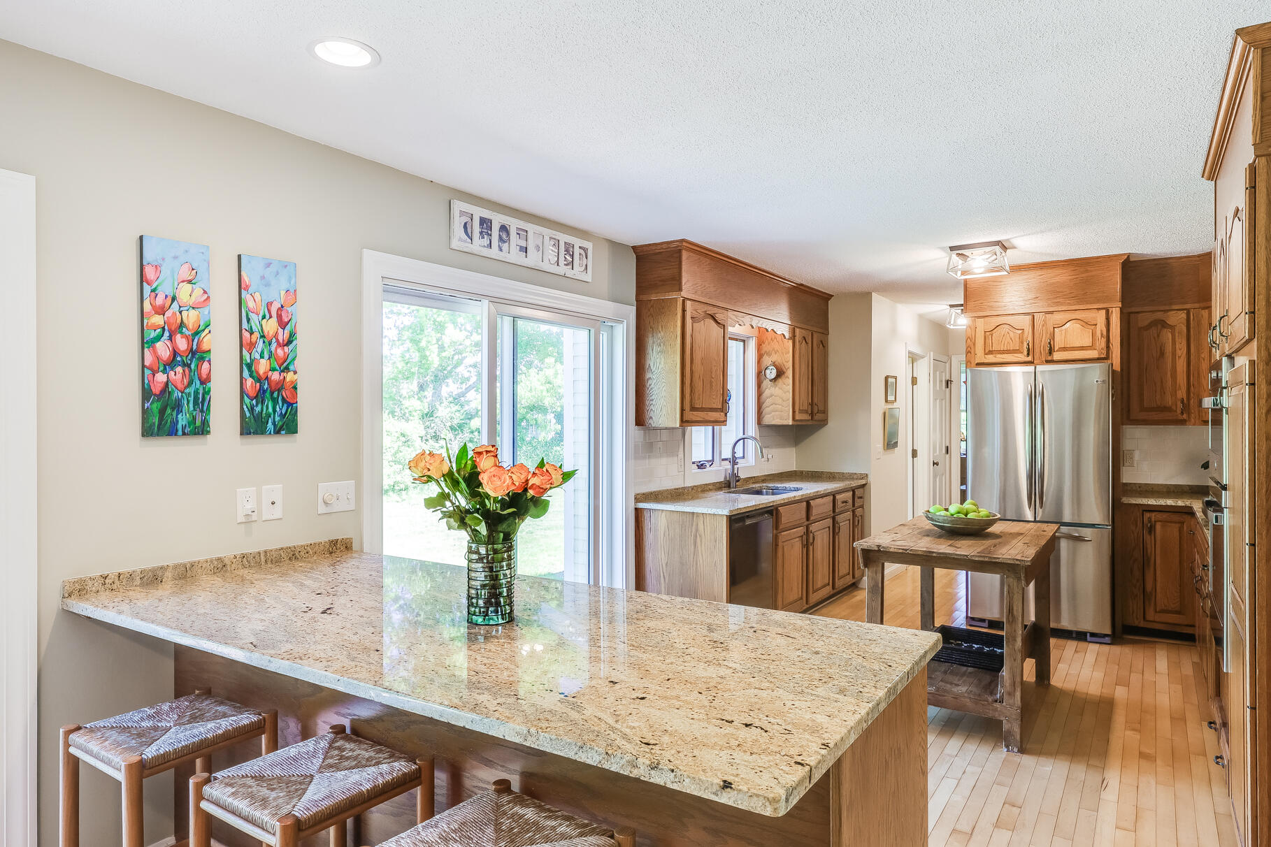 28 Sand Bar Lane Brewster, MA 02631 - Photo 15 of 74 a kitchen with a table and chairs in it