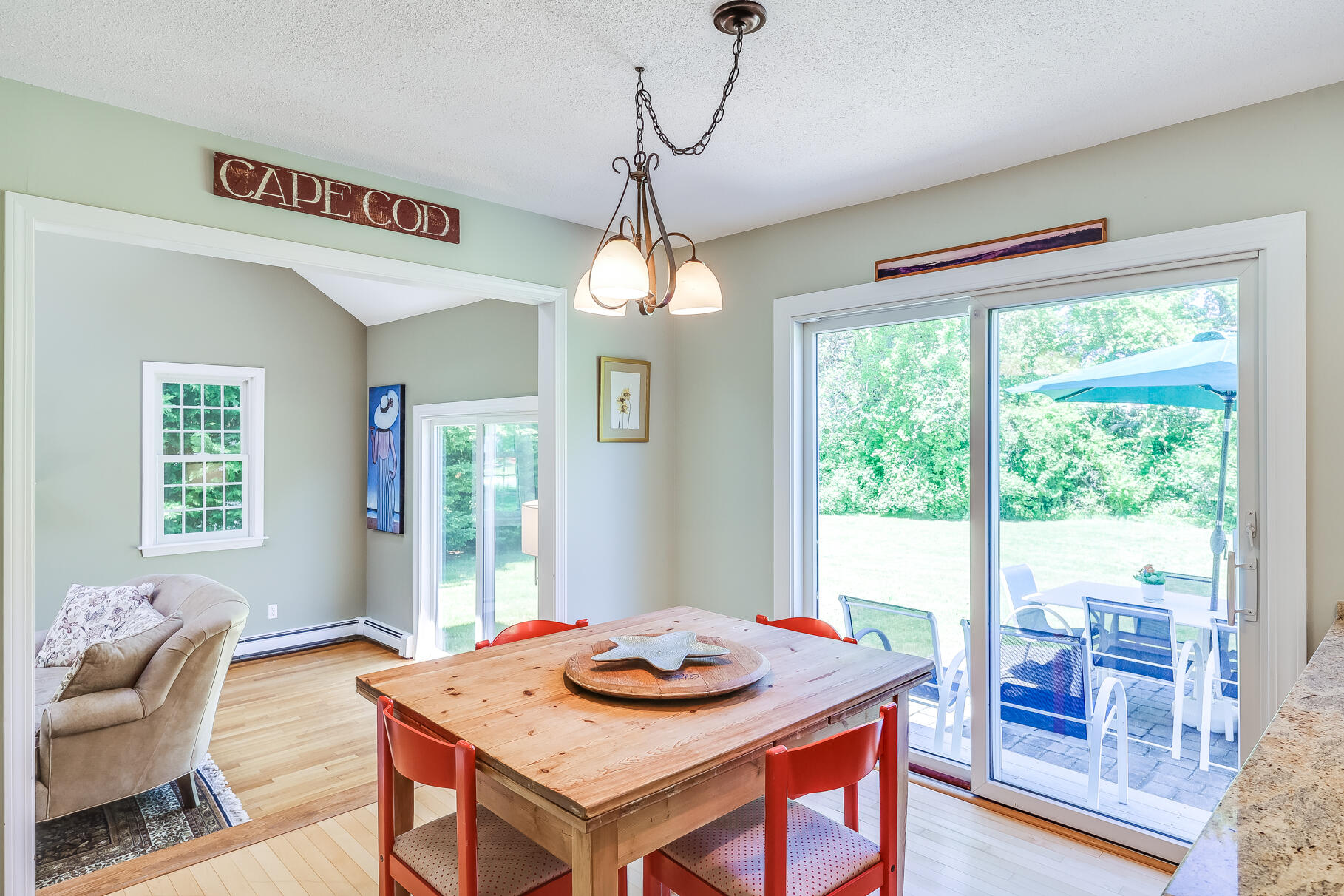 28 Sand Bar Lane Brewster, MA 02631 - Photo 16 of 74 a view of a dining room with furniture window and outside view