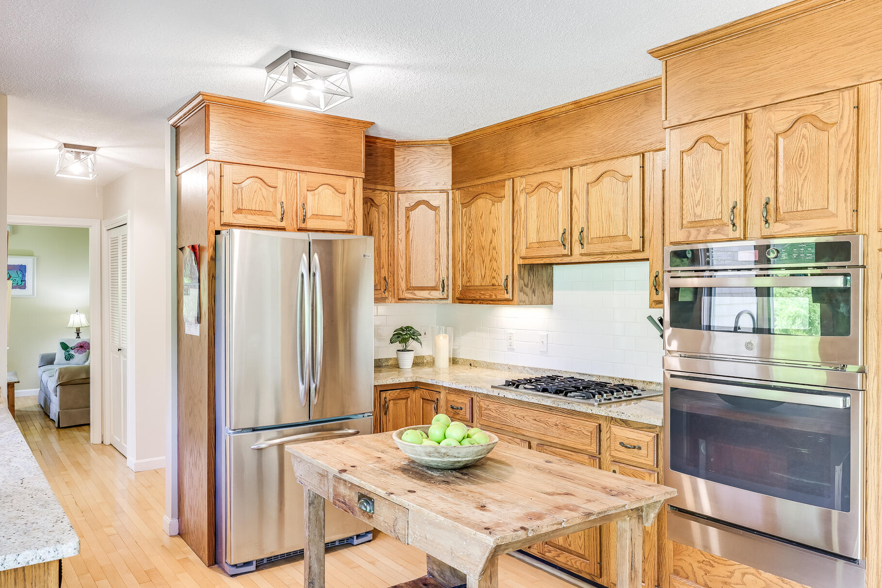 28 Sand Bar Lane Brewster, MA 02631 - Photo 20 of 74 a kitchen with stainless steel appliances granite countertop a refrigerator and a stove top oven