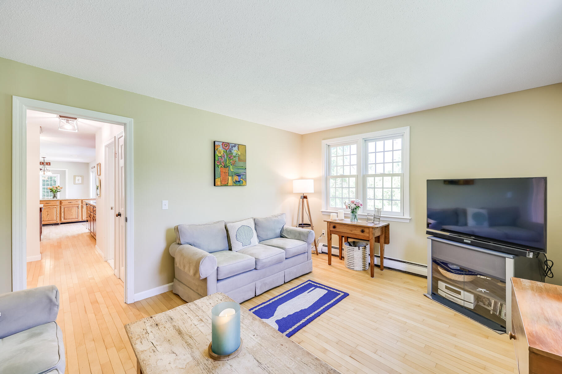 28 Sand Bar Lane Brewster, MA 02631 - Photo 27 of 74 a living room with furniture and a flat screen tv