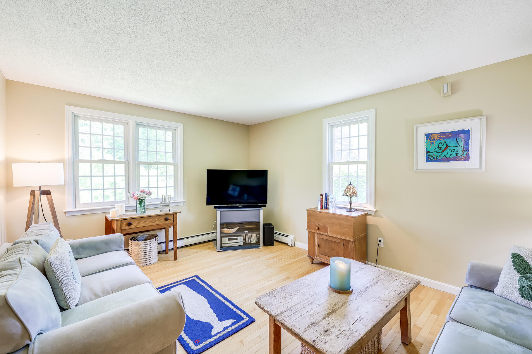 28 Sand Bar Lane Brewster, MA 02631 - Photo 28 of 74 a living room with furniture a flat screen tv and a window