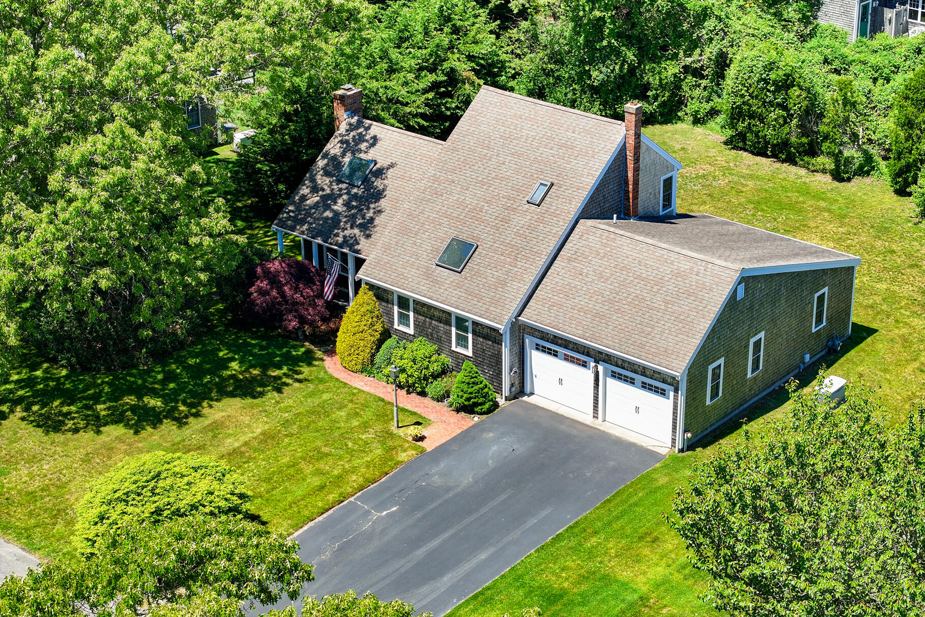 28 Sand Bar Lane Brewster, MA 02631 - Photo 3 of 74 an aerial view of a house