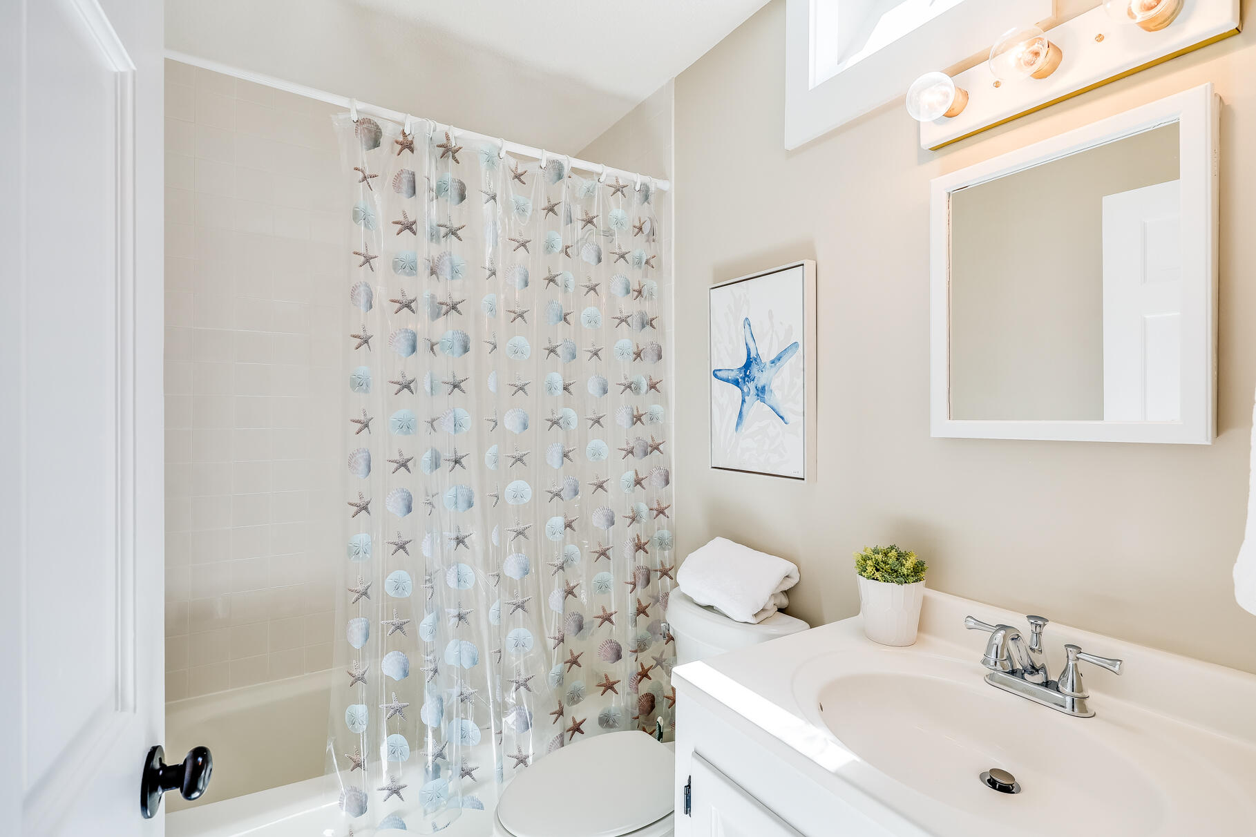 28 Sand Bar Lane Brewster, MA 02631 - Photo 38 of 74 a bathroom with a sink toilet and mirror