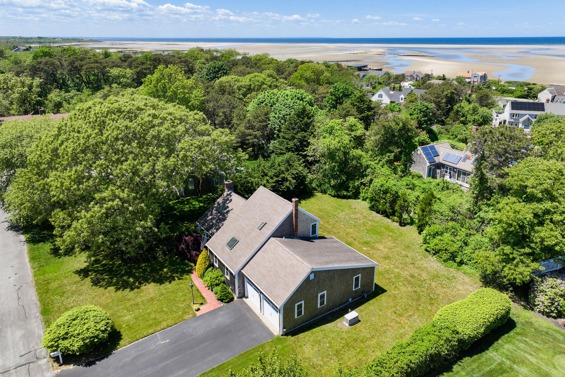 28 Sand Bar Lane Brewster, MA 02631 - Photo 7 of 74 an aerial view of a house with garden space and street view