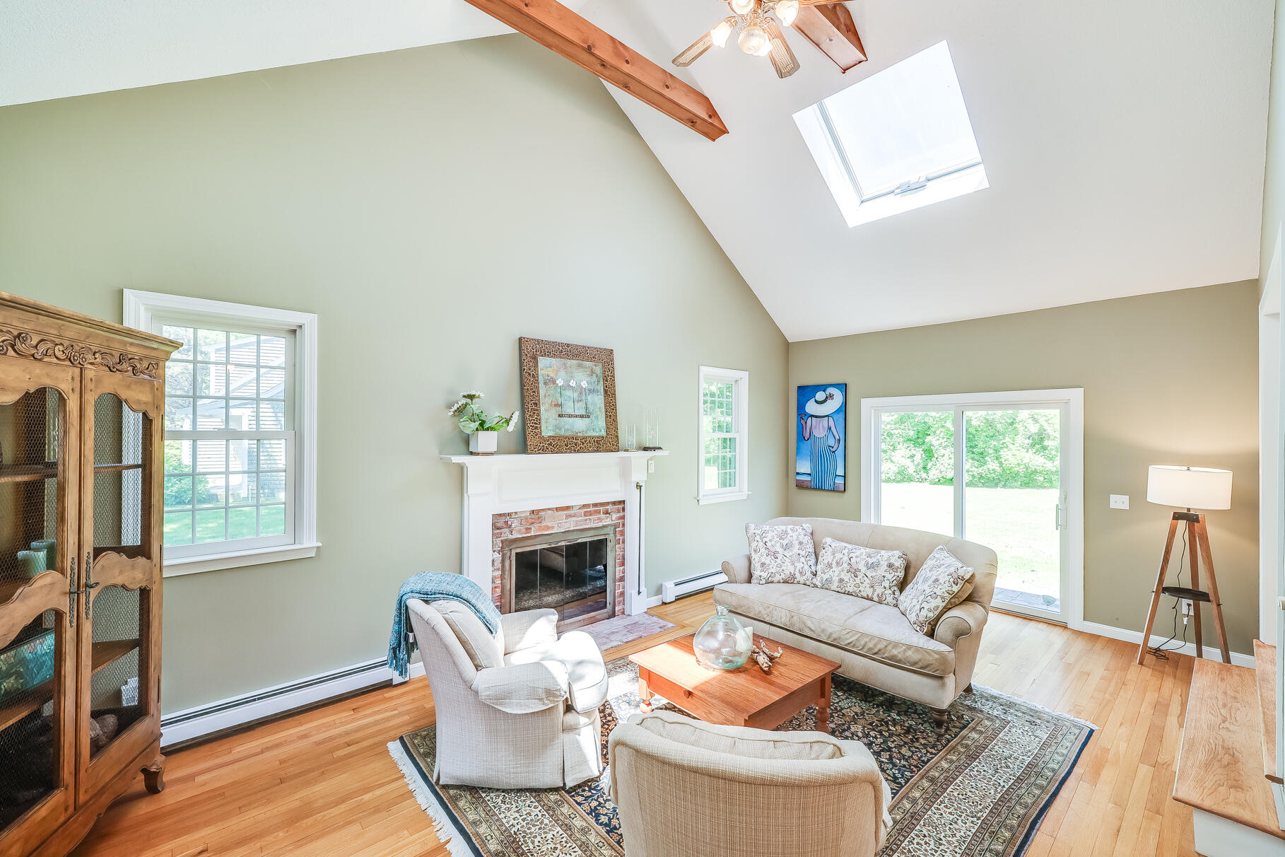 28 Sand Bar Lane Brewster, MA 02631 - Photo 9 of 74 a living room with fireplace furniture and a window