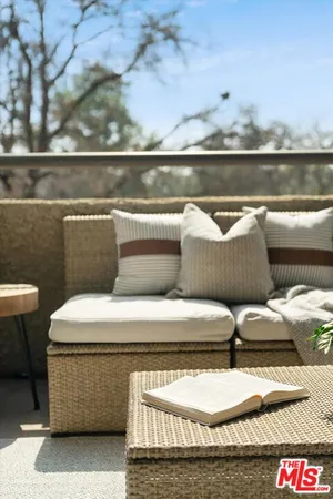 a view of balcony with two chairs