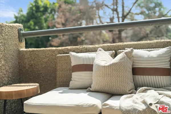 a bedroom with a bed and a potted plant