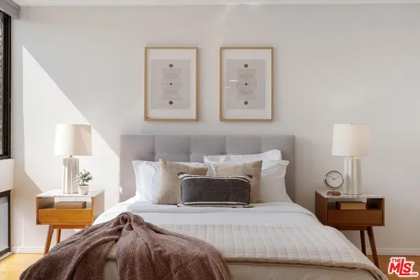 a view of hallway with furniture and wooden floor