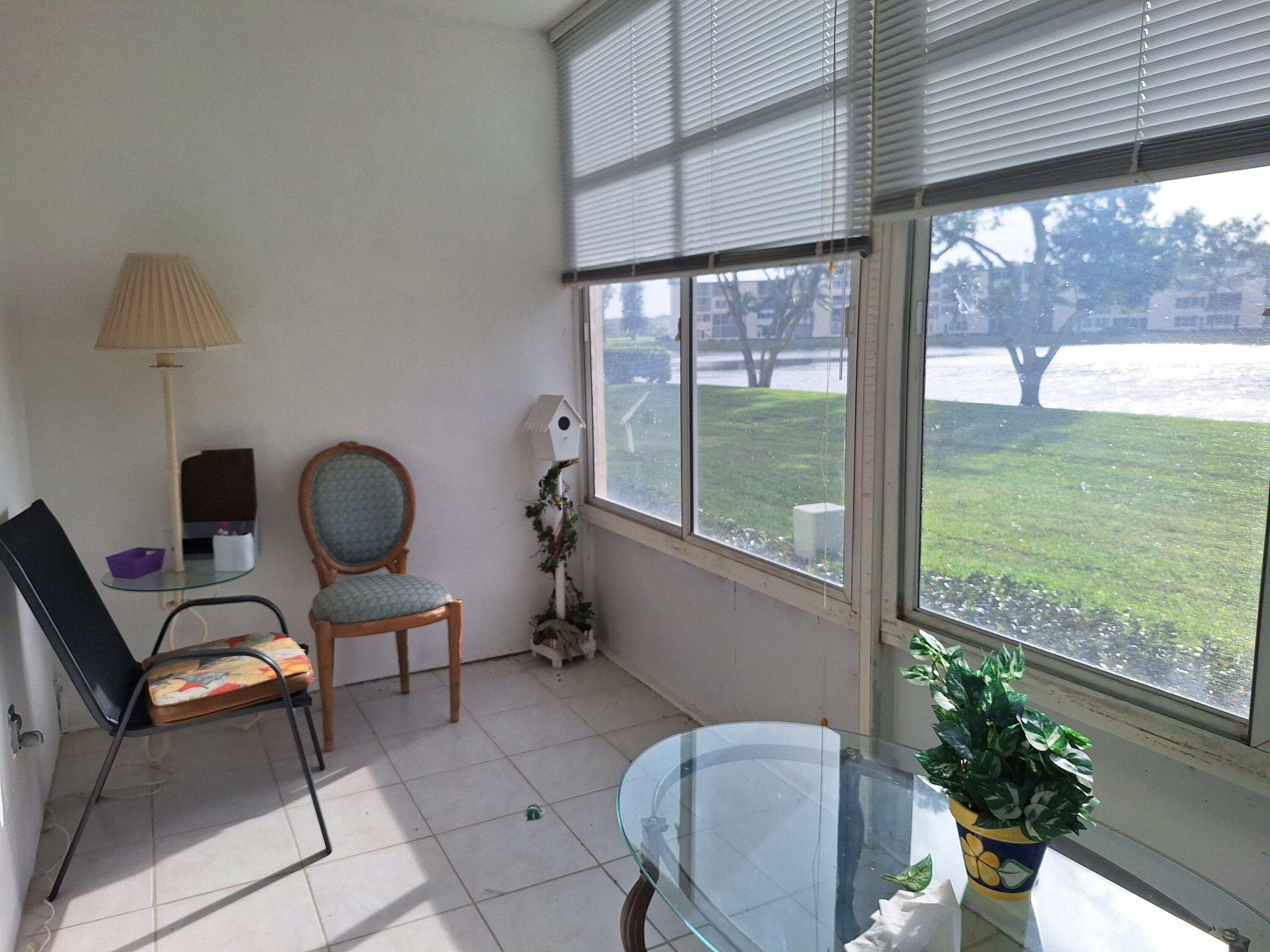 1010 Wolverton East Boca Raton, FL 33434 - Photo 13 of 30 a view of a porch with chairs and backyard