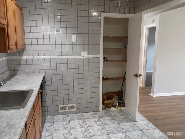 a bathroom with a sink a toilet and a shower