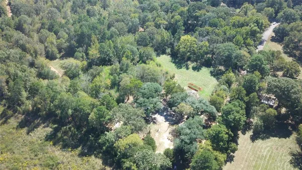 an aerial view of a houses with yard and outdoor space