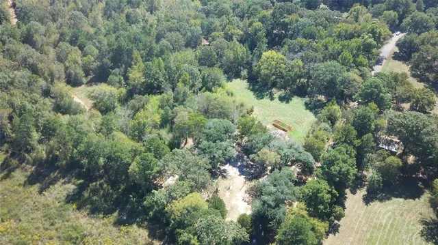 an aerial view of a houses with yard and outdoor space