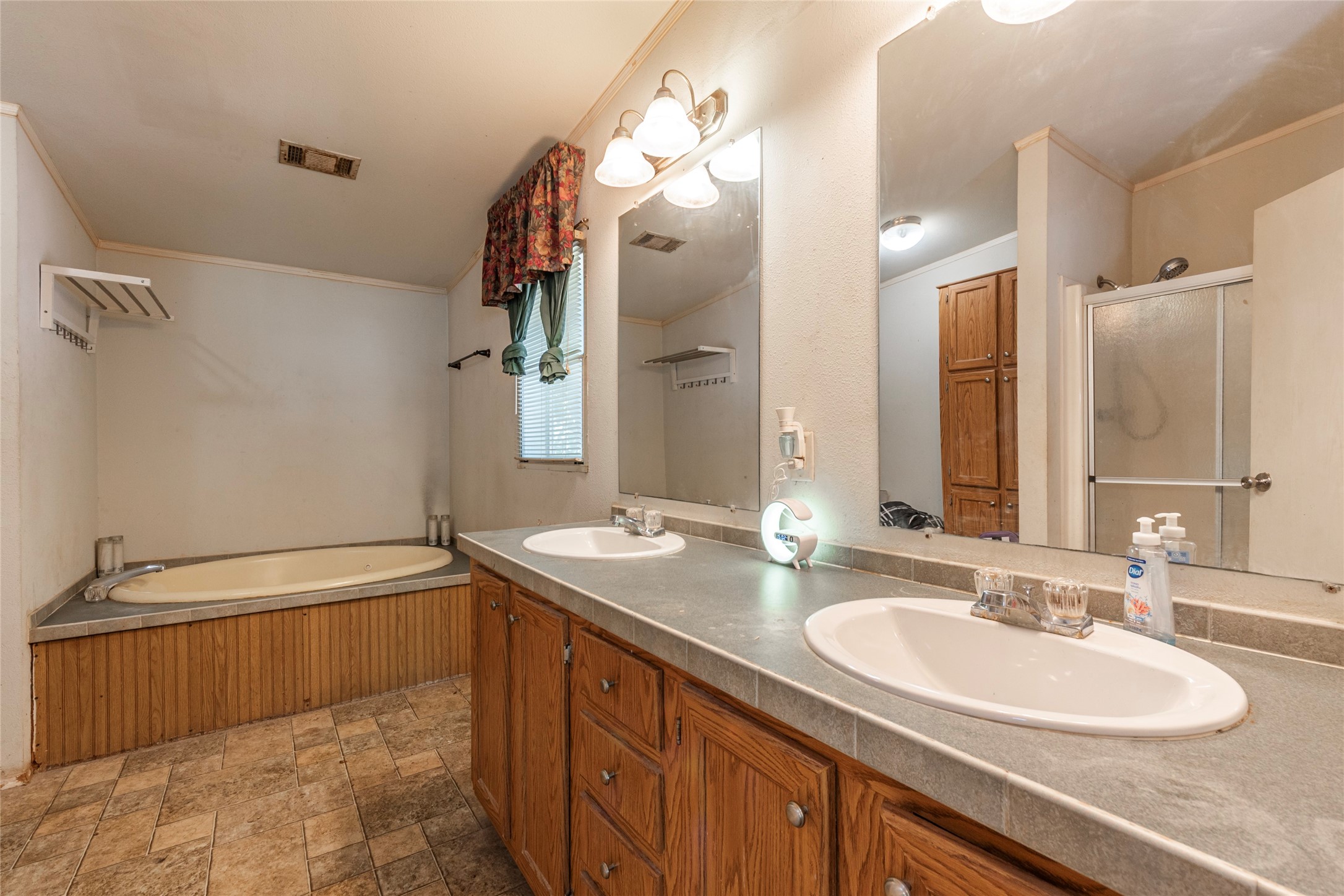 4624 6th Street Bacliff, TX 77518 - Photo 19 of 36 a bathroom with a sink double vanity and a mirror